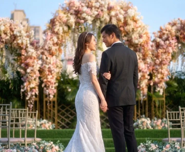 HEYA casebook cover: a couple in front of a flower arch