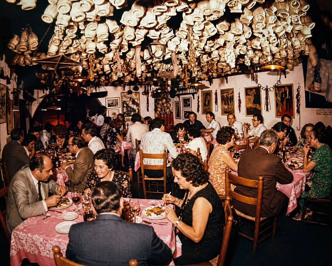 La Taverna casebook cover: a packed dining room with decorations hanging from the ceiling